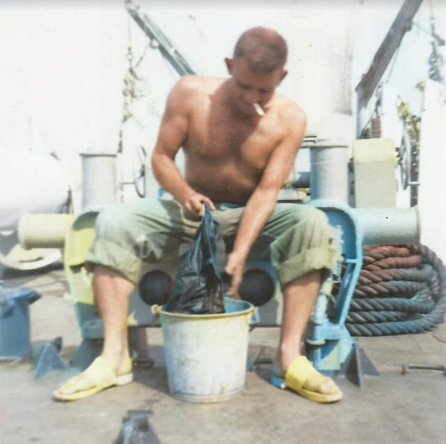 Ed on USS Sage washinhg clothes COLORIZED