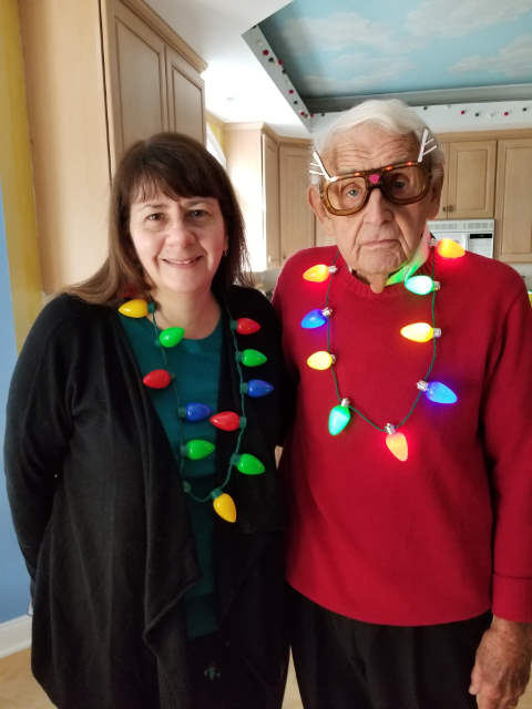 2019-12-25 Mary and Ed with Christmas Necklaces, Little Fox, Norwalk, CT